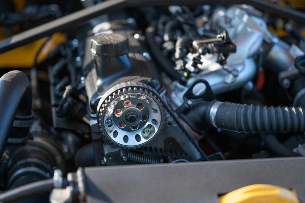Closeup of a metallic timing belt of a car with chain